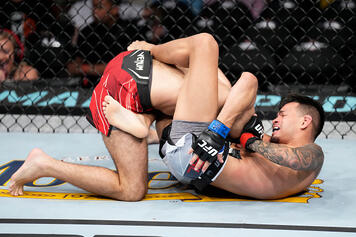 Brandon Royval secures a guillotine choke submission against Matt Schnell in a flyweight fight during the UFC 274 event at Footprint Center on May 07, 2022 in Phoenix, Arizona. (Photo by Chris Unger/Zuffa LLC)