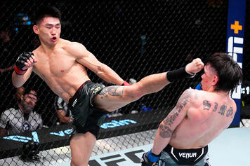 Song Yadong of China kicks Ricky Simon in a bantamweight fight during the UFC Fight Night event at UFC APEX on April 29, 2023 in Las Vegas, Nevada. (Photo by Jeff Bottari/Zuffa LLC)